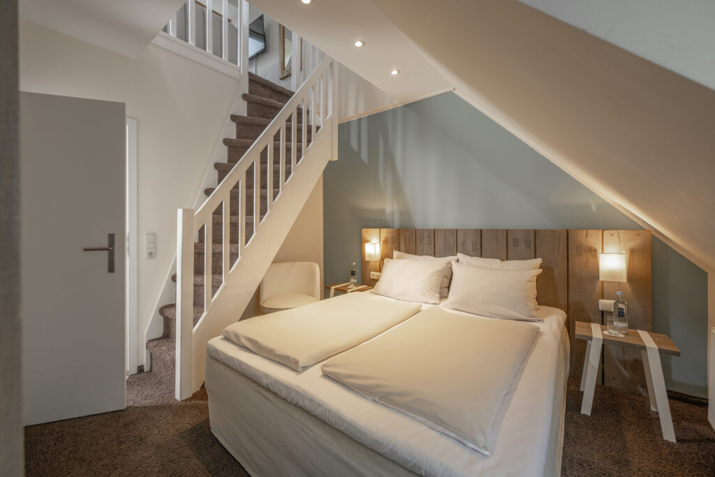 Gemütlich und nachhaltig: Die nordisch eingerichteten Zimmer im Lifestylehotel SAND