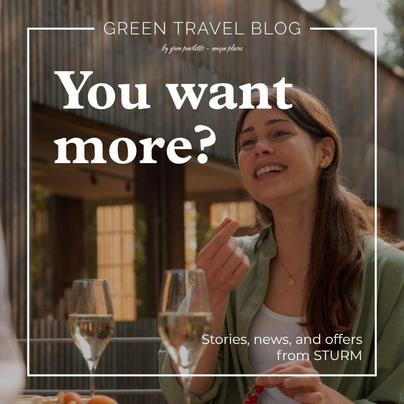 Woman smiling at an outdoor cafe, holding a glass of wine. Text overlay reads "You want more?" promoting a green travel blog. Relaxed atmosphere.