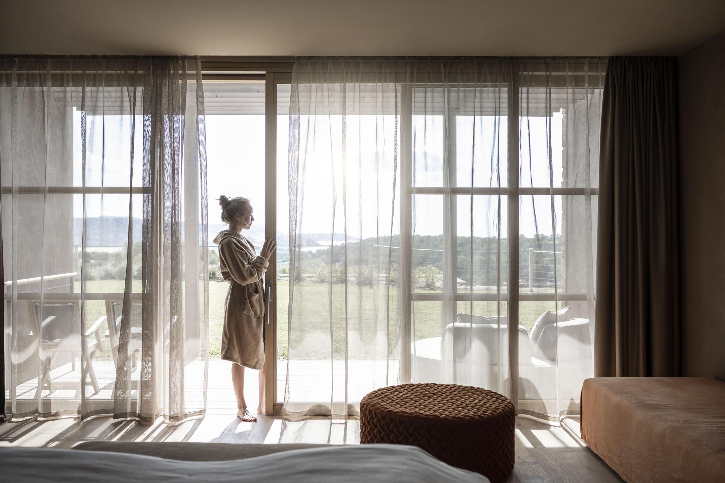 Sustainable Travel: Woman in a Hotelroom at ADLER Spa Resort SICILIA