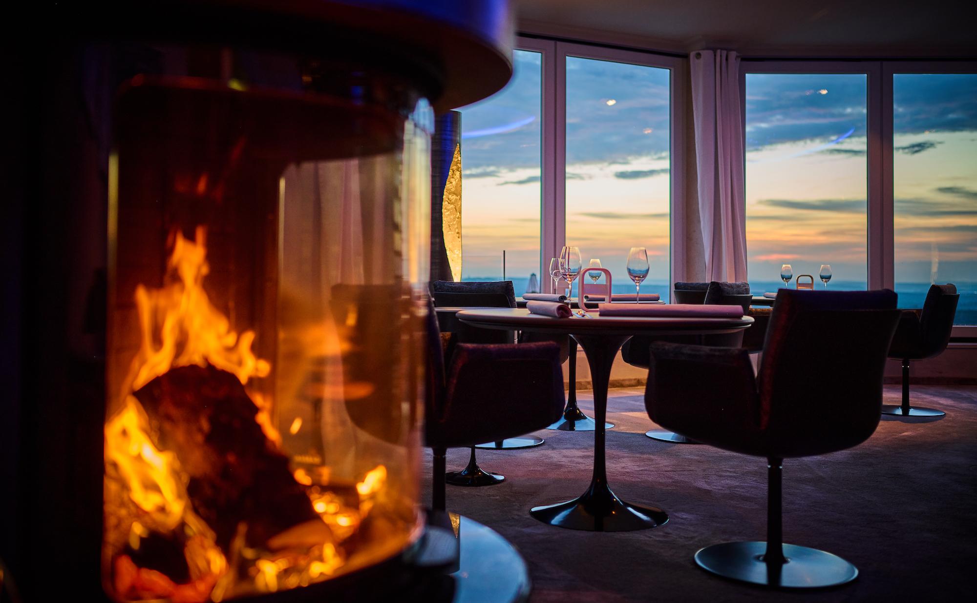 Restaurant with fireplace and view at Birkenhof in Germany