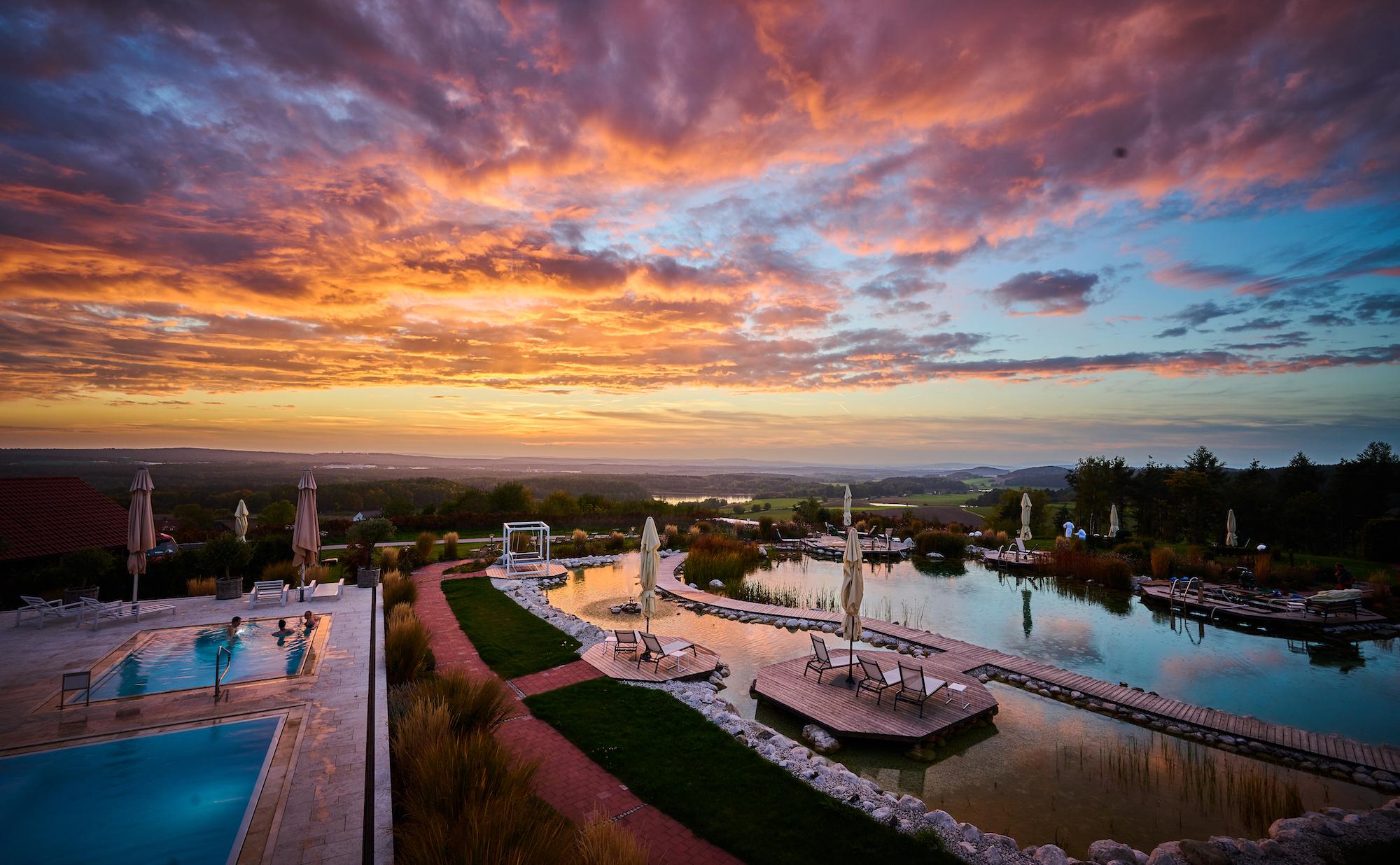 Sustainable Hotel Der Birkenhof: outdoor wellness area at sunset