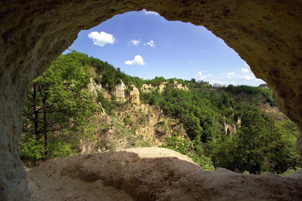 View from a rock cave of forested rock formations in the Piedmont region